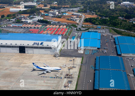 NARITA, JAPAN - CIRCA APR, 2013: Aerial view at the hangars and runway of the Narita International Airport. Narita Airport is the predominant airport. Stock Photo