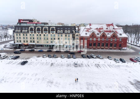 VYBORG, RUSSIA - CIRCA JAN, 2017: Building of the hotel Victoria and parking space are at the Market Square in the center. Vyborg is town in Leningrad Stock Photo