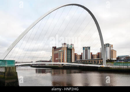 Gateshead Millennium Bridge over the River Tyne links Gateshead Quays and Baltic Centre on the south bank with Newcastle Quayside on the north bank.. Stock Photo