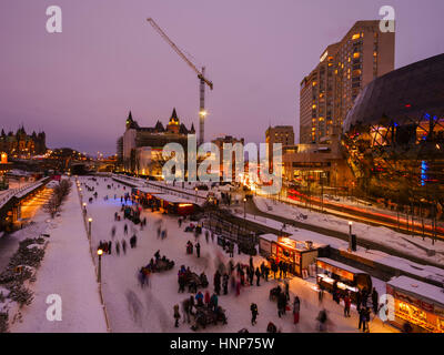 Ottawa, Canada - February 12, 2017:  People skate on the Rideau Canal Skateway to celebrate the Winterlude Festival Stock Photo