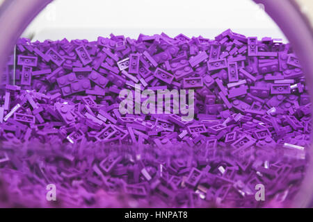Pile of plastic brick toy in purple colour (vintage style) Stock Photo
