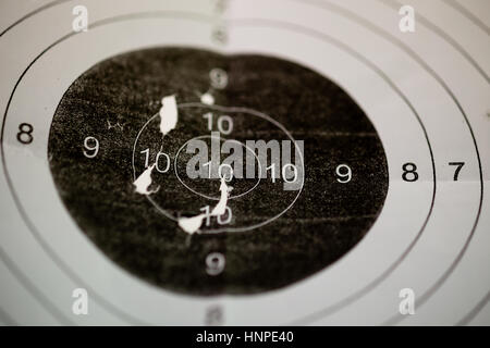 Bullet holes in shooting range target Stock Photo