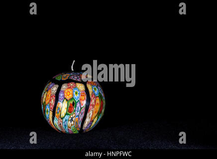 UMEA, SWEDEN ON SEPTEMBER 23, 2013. A painted candle in colorful texture. A souvenir. Illustrative Editorial. Stock Photo