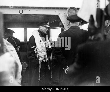 KING GEORGE VI (1895-1952) on board H.M.S. Arethusa visiting the Normandy beachhead in July 1944. Back to camera is First Sea Lord Admiral Andrew Cunningham Stock Photo