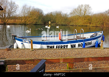 A view of the open Horning Ferry Inn passenger ferry boat on the River Bure at Horning, Norfolk, England, United Kingdom. Stock Photo