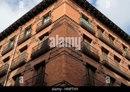 Corner in perspective of a red brick building in Madrid, Spain. Stock Photo