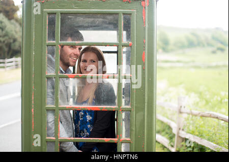 A couple recently engaged show their love for each other near seven sisters, East Sussex, UK. Stock Photo