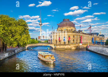 Classic view of Berlin Museum Island with famous TV tower and excursion boat on Spree river in beautiful golden evening light at sunset, Berlin Mitte Stock Photo