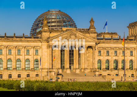 Close-up view of famous Reichstag building, seat of the German Parliament (Deutscher Bundestag), in beautiful golden evening light at sunset, Berlin Stock Photo