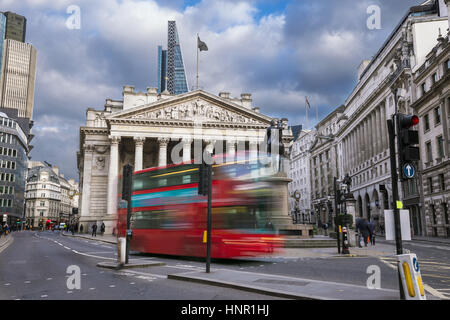 London, England - The Royal Echnage building with moving red double decker bus on the move Stock Photo