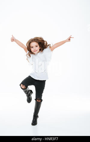 happy little girl jumping over blue sky and clouds Stock Photo - Alamy