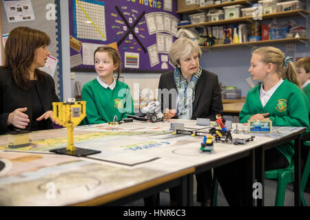 RETRANSMITTED CORRECTING LOCATION FROM MERSEYSIDE TO CUMBRIA Prime Minister Theresa May sits with year six pupils during a visit to Captain Shaw's Primary School in Bootle, Cumbria, with Conservative Party candidate for the Copeland by-election, Trudy Harrison. Stock Photo