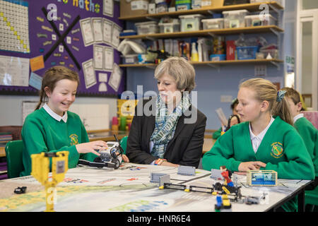 RETRANSMITTED CORRECTING LOCATION FROM MERSEYSIDE TO CUMBRIA Prime Minister Theresa May sits with year six pupils during a visit to Captain Shaw's Primary School in Bootle, Cumbria, with Conservative Party candidate for the Copeland by-election, Trudy Harrison. Stock Photo