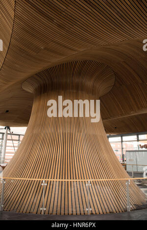 A general view of interior woodwork on the ceiling and funnel of the Senedd, home of the Welsh Assembly, in Cardiff Bay, South Wales, UK. Stock Photo