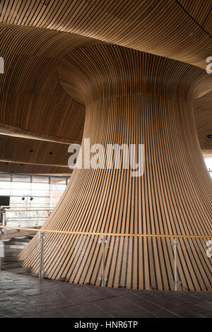 A general view of interior woodwork on the ceiling and funnel of the Senedd, home of the Welsh Assembly, in Cardiff Bay, South Wales, UK. Stock Photo