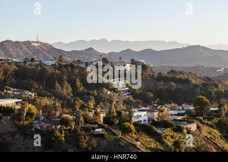 Los Angeles, California, USA - January 1, 2015:  Hollywood Hills homes and the Hollywood Sign in the Santa Monica Mountains above Los Angeles. Stock Photo