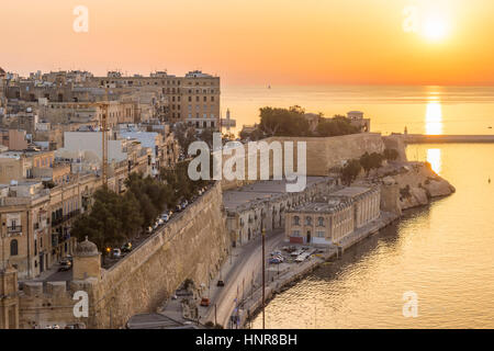Valletta, Malta - Sunrise in Malta with the ancient wall of Valletta and Grand Harbour Stock Photo