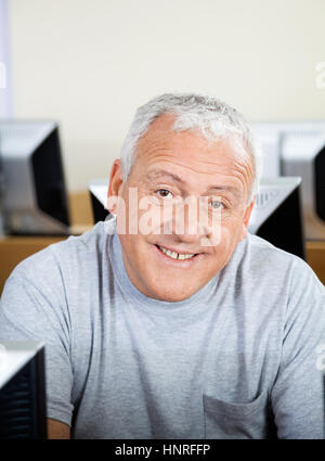 Happy Senior Man In Computer Class Stock Photo