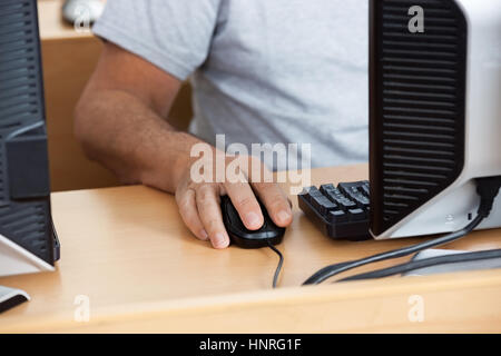 Senior Student Using Computer In Classroom Stock Photo