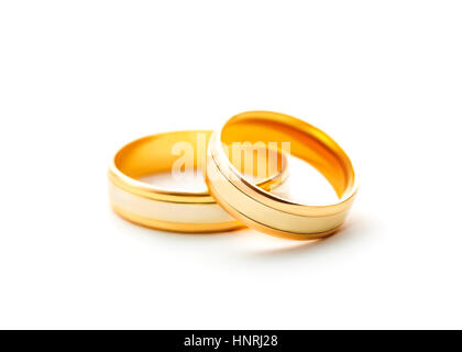 Pair golden wedding rings isolated on white background Stock Photo