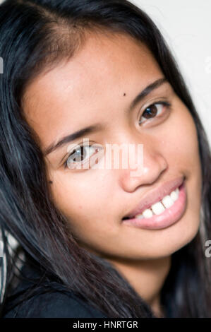 Young Asian woman in studio setting Stock Photo