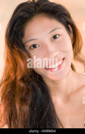 Young Asian woman in studio setting Stock Photo