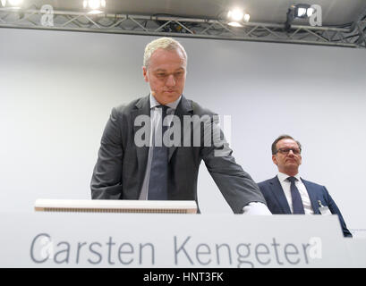 The CEO of the German equity trading firm Deutsche Börse AG Carsten Kengeter (L) with the company's press officer Martin Halusa at a press conference at which the firm's annual figures were made public in Frankfurt am Main, Germany, 16 February 2017. Kengeter is currently under investigation after accusations of insider trading were raised. Photo: Arne Dedert/dpa Stock Photo