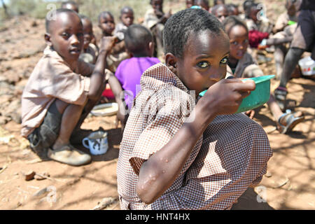 Kajiado, Kenya. 16th February, 2017. Students of the Olomayiana West Primary School enjoy their lunch, porridge cooked with government aid food, at Olomayiana West Primary School in Kajiado County, Kenya, Feb. 15, 2017. The Kenyan government last Friday declared the current drought affecting 23 arid and semi-arid counties and pockets of other areas a national disaster. The UN Food and Agriculture Organization (FAO) have warned that Kenya is facing a severe drought and with it a rise in food insecurity. Credit: Xinhua/Alamy Live News Stock Photo