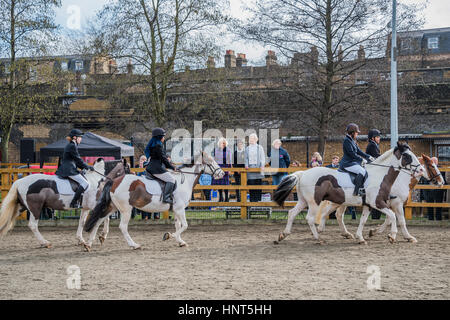 London, UK. 16th February 2017. Watching the riding display - The Duchess of Cornwall, President, Ebony Horse Club, visits the charity's Brixton riding centre. The centre is celebrating its 21st birthday and its 6th year on this site. London 16 Feb 2017 . Credit: Guy Bell/Alamy Live News Stock Photo