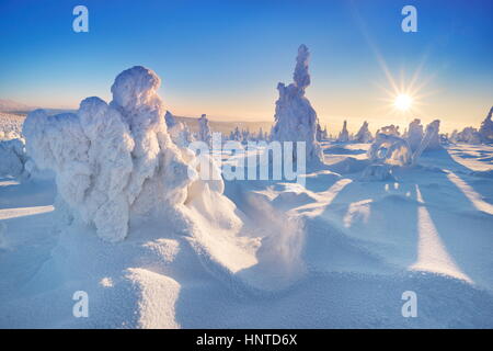 Winter snow scenery at sunset time, Karkonosze Mountains, Poland Stock Photo