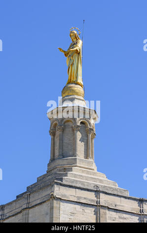 Gilded statue of the Virgin Mary atop the bell tower of the Roman Catholic Avignon Cathedral, Avignon, France Stock Photo