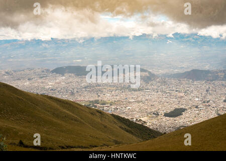 The TelefériQo in Quito, Ecuador, running from the edge of the city up the east side of Pichincha Volcano.View from the top looking at Cruz Loma Stock Photo