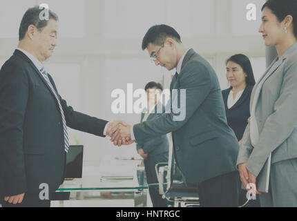 Business Partners Introductionary Handshake Bow Stock Photo