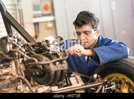 Mechanic working on a car engine Stock Photo