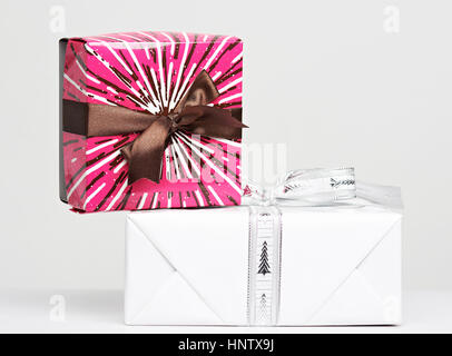 two colorful gift boxes on top of each other isolated on white Stock Photo