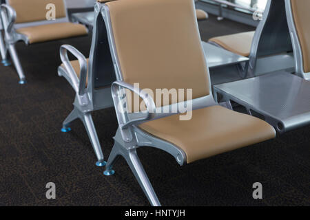 brown leather chair in airport terminal building Stock Photo - Alamy