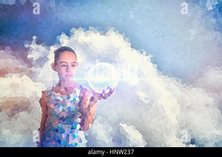 Pixelated Mixed Race girl holding glowing sphere Stock Photo