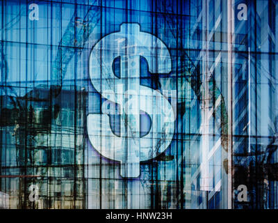 Dollar sign on highrise and construction cranes Stock Photo