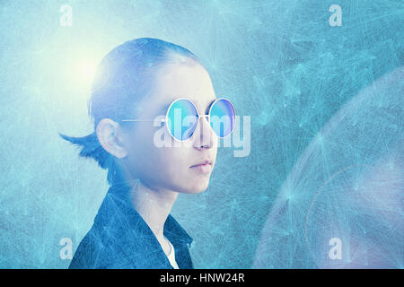 Mixed Race girl wearing sunglasses in cyberspace Stock Photo