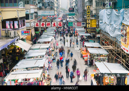 HONG KONG - FEB 18, 2014: Crowded Mong Kok street market, 18 February 2014, Hong Kong. Stock Photo