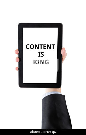 hand of businessman holding digital tablet with word content is king isolated on white background with clipping path Stock Photo