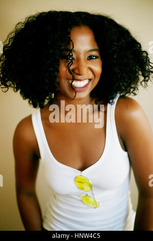 Portrait of laughing Mixed Race woman Stock Photo