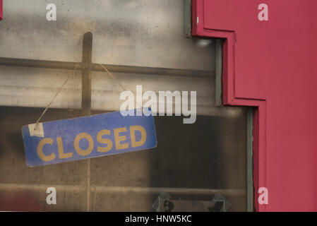 A closed sign in the window of an old store in San Francisco Stock Photo