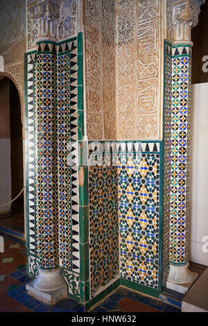 Moorish arabesque ceramic tiles sculpted plasterwork of the Palacios Nazaries,  Alhambra. Granada, Andalusia, Spain. Stock Photo