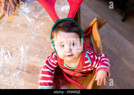 Portrait of baby boy wearing reindeer antlers Stock Photo