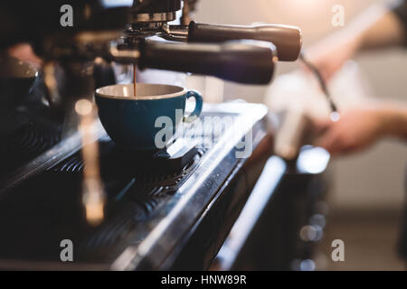 Coffee machine filling cup Stock Photo