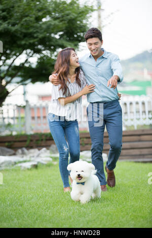 Harmonious couple with pet dog Stock Photo