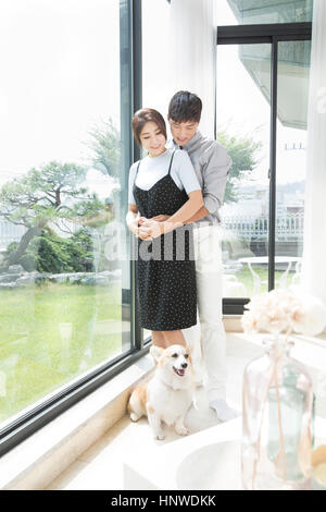 Loving couple with pet Stock Photo