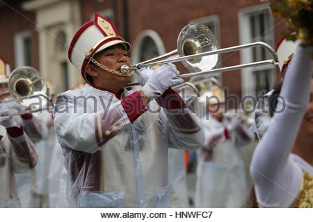 A musician performs during a parade highlight American college football in Dublin Stock Photo