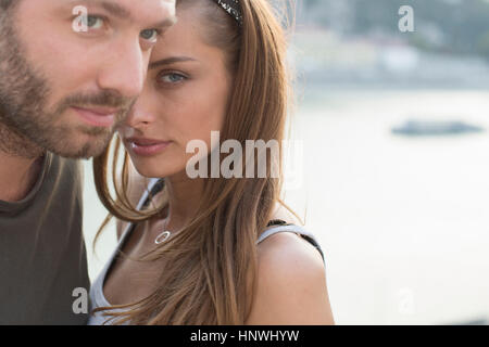 Portrait of sultry young couple on waterfront,  Budapest, Hungary Stock Photo